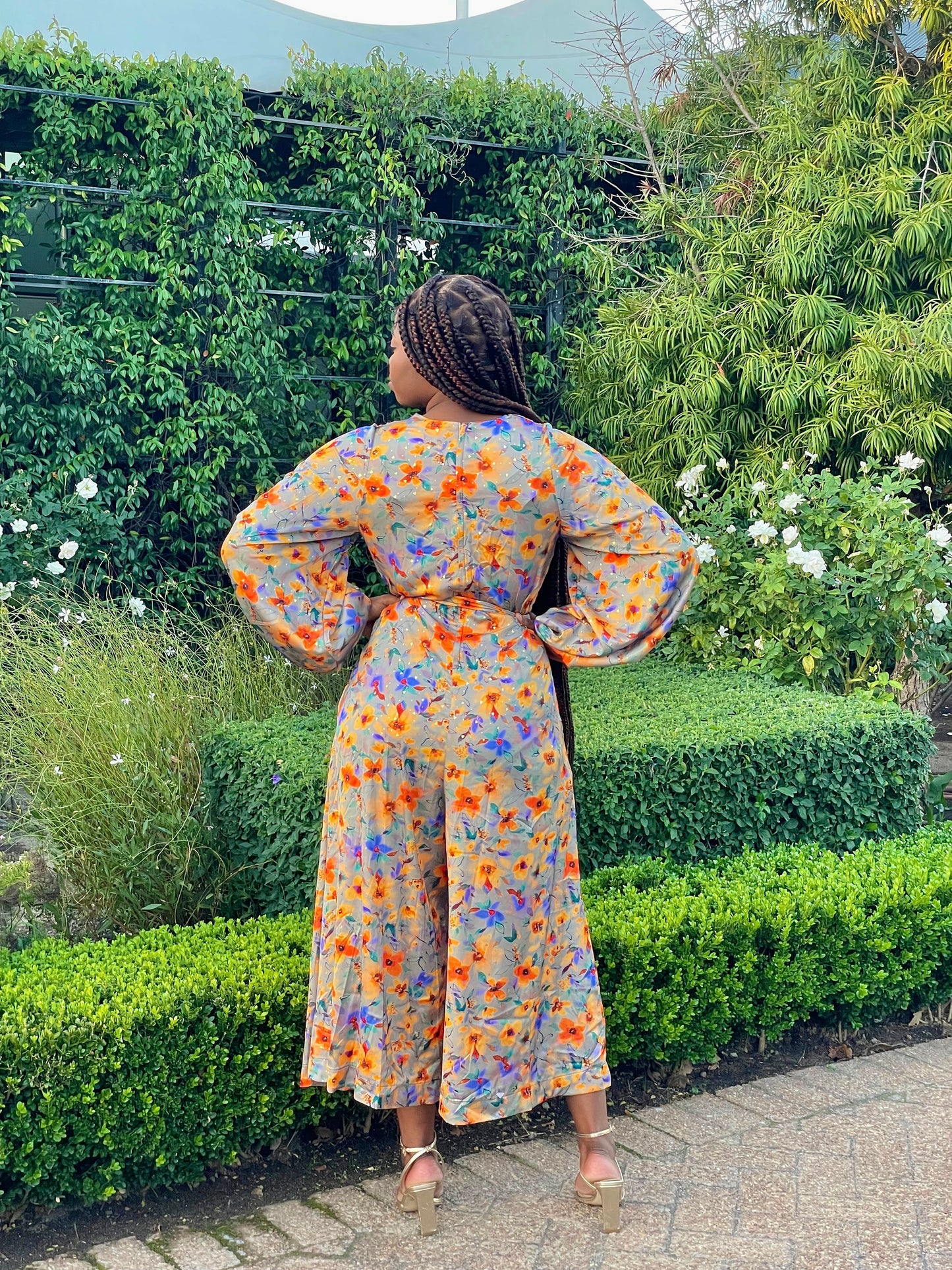 ORANGE FLORAL FRILLED LONG SLEEVED JUMPSUIT